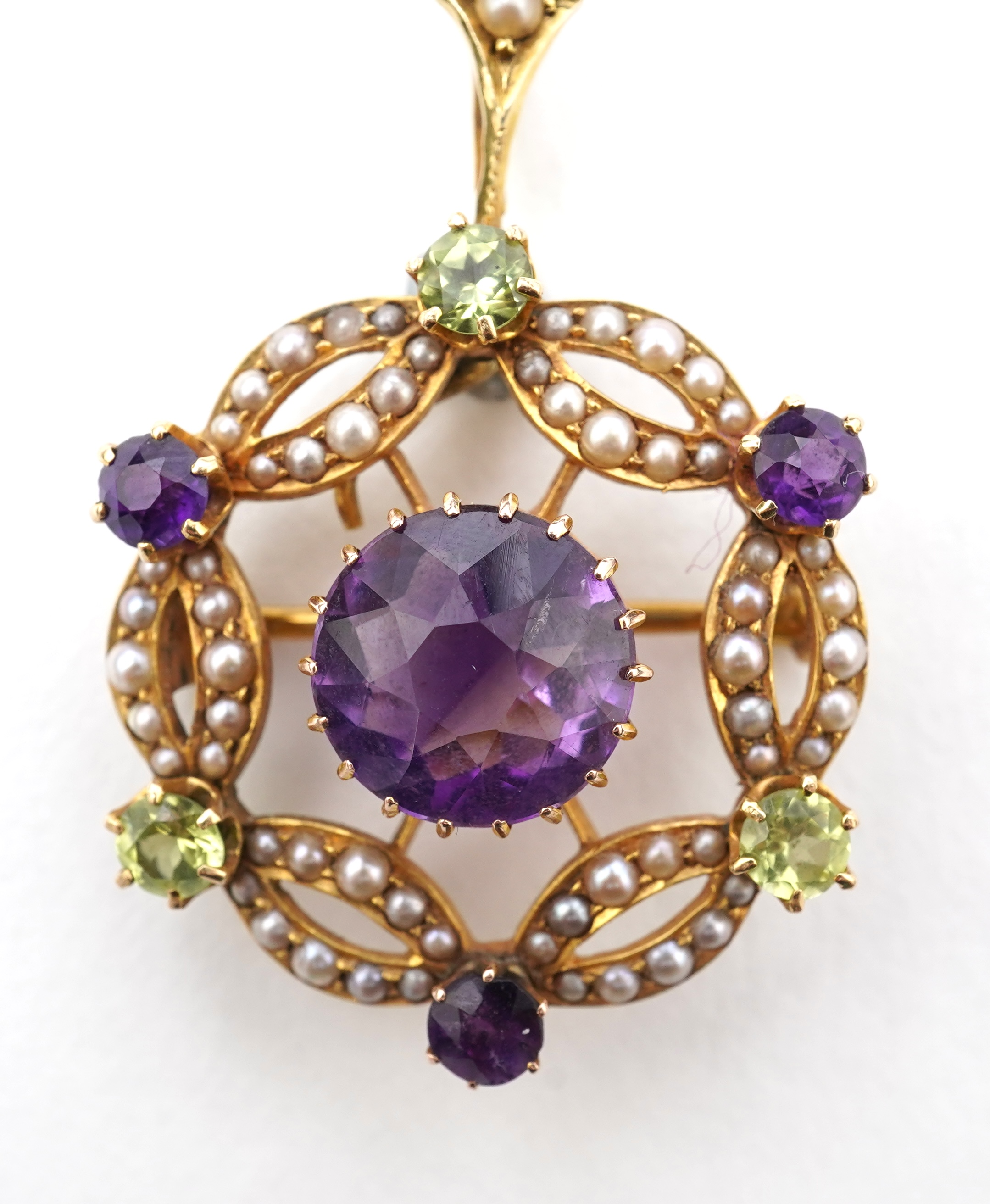 An Edwardian amethyst, chrysoberyl and seed pearl pendant/brooch, early 20th century